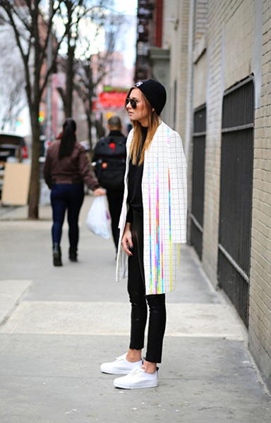 Girl wearing minimalistic coat with the designed print
